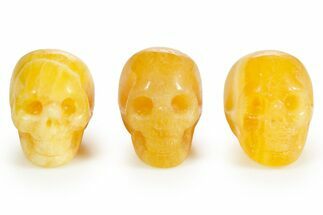 1.5" Polished Orange Calcite Skulls